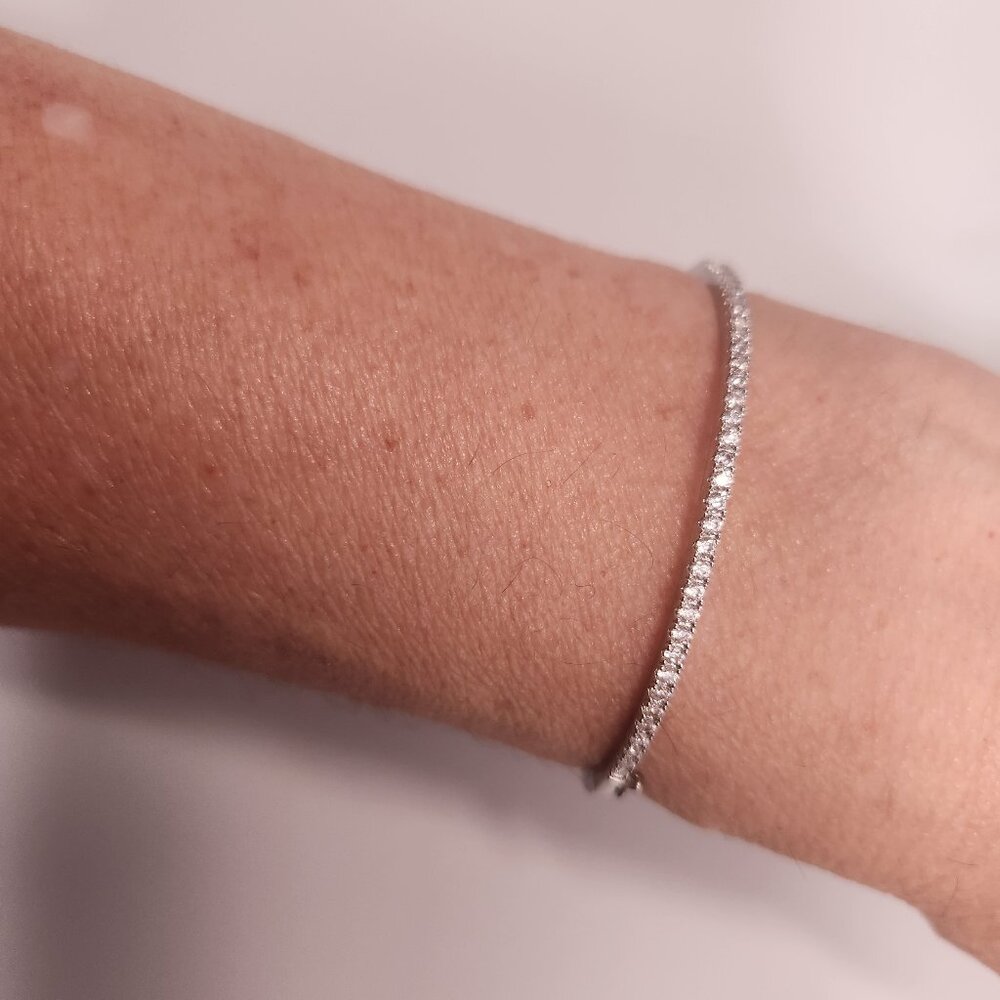 NWOT silver tone bangle with cubic zirconia